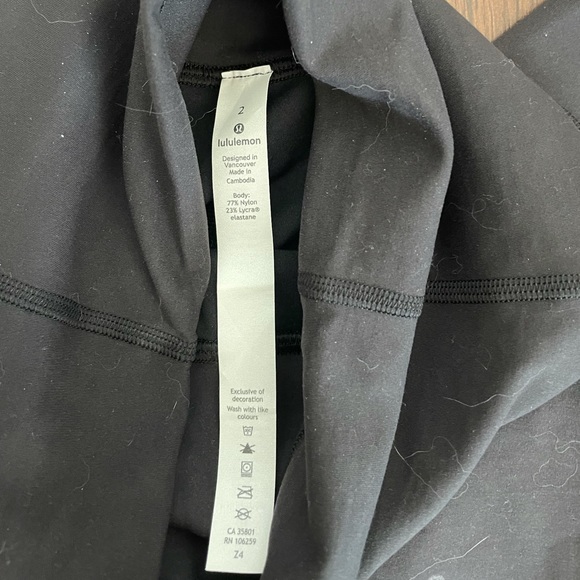 ❌SOLD❌ Lululemon limited edition black leggings with black and gold logo print - Picture 2 of 5